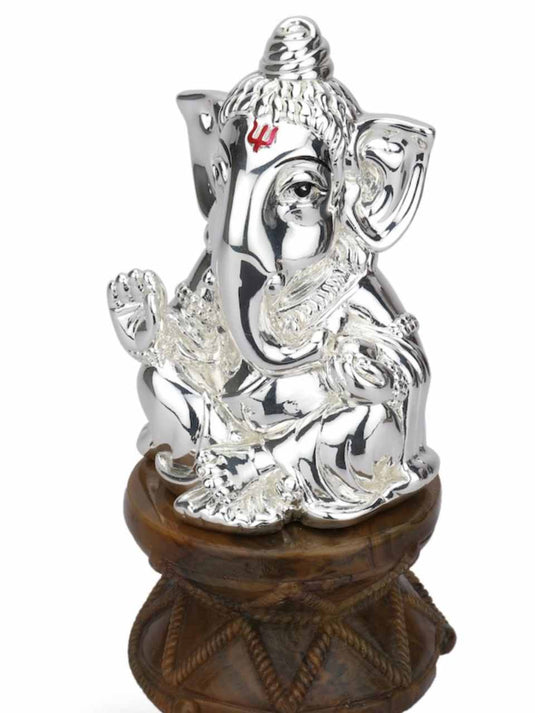 Small Ganesha sitting on cube